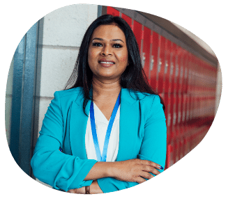 woman with arms crossed smiling at camera
