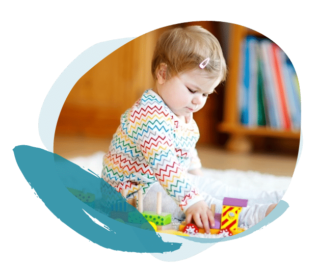 little girl playing with toy